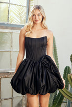 Model wearing Amelia Couture Prom Dress Style 2081S by amelia couture, featuring a strapless black bubble skirt design.