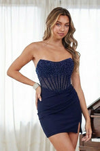 Young woman wearing Amelia Couture Prom Dress Style 3119S navy blue strapless fitted mini dress by amelia couture