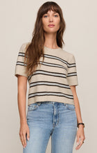 Woman wearing Light Oatmeal Heather Gatewood Stripe Sweater by z supply with short sleeves and horizontal stripes.
