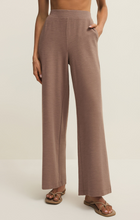 Model wearing Milk Shake Andre Wide Leg Pant by z supply in neutral tone with relaxed fit and side pockets