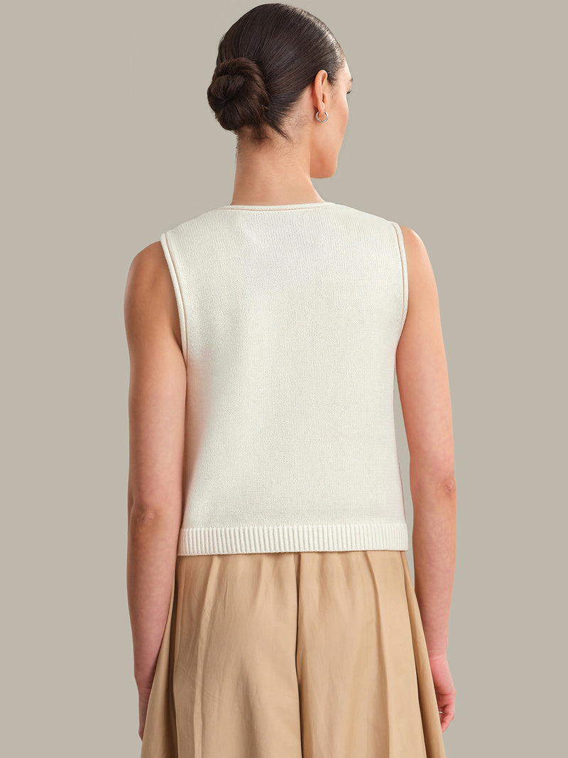 Woman wearing Chalk Marianna Rolled Edge Button Front Tank by 525 america, shown from the back in a neutral setting.