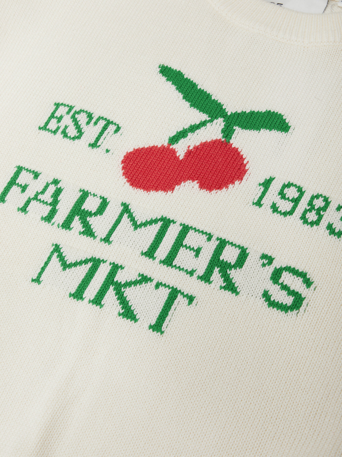 Close-up of 525 america Chalk Combo Bella Graphic Pullover featuring red cherries and green farmer's market text on cream fabric.