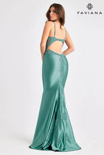 Woman wearing Faviana Prom Dress Style 11403 in dark pacific blue with lace details and open back design from Faviana