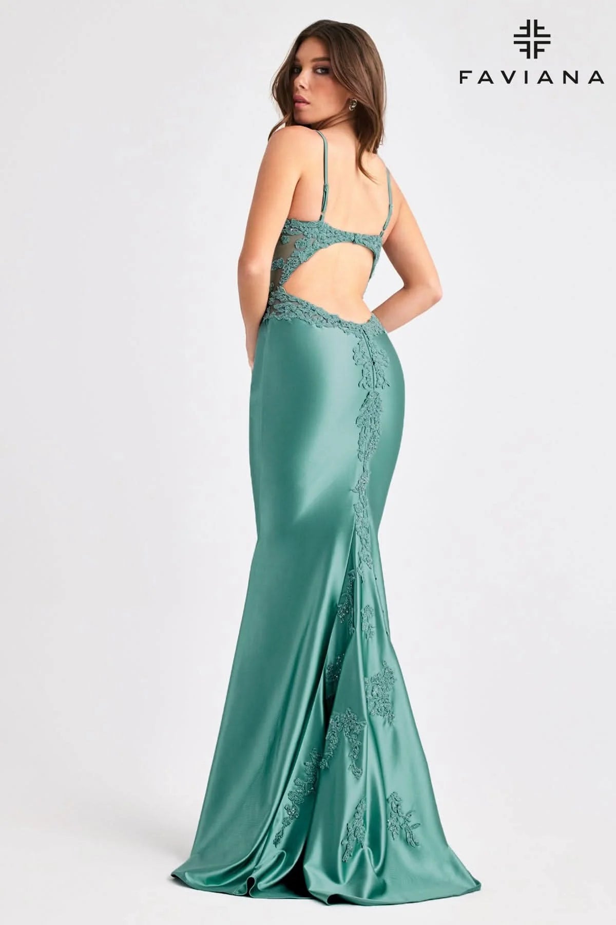 Woman wearing Faviana Prom Dress Style 11403 in dark pacific blue with lace details and open back design from Faviana