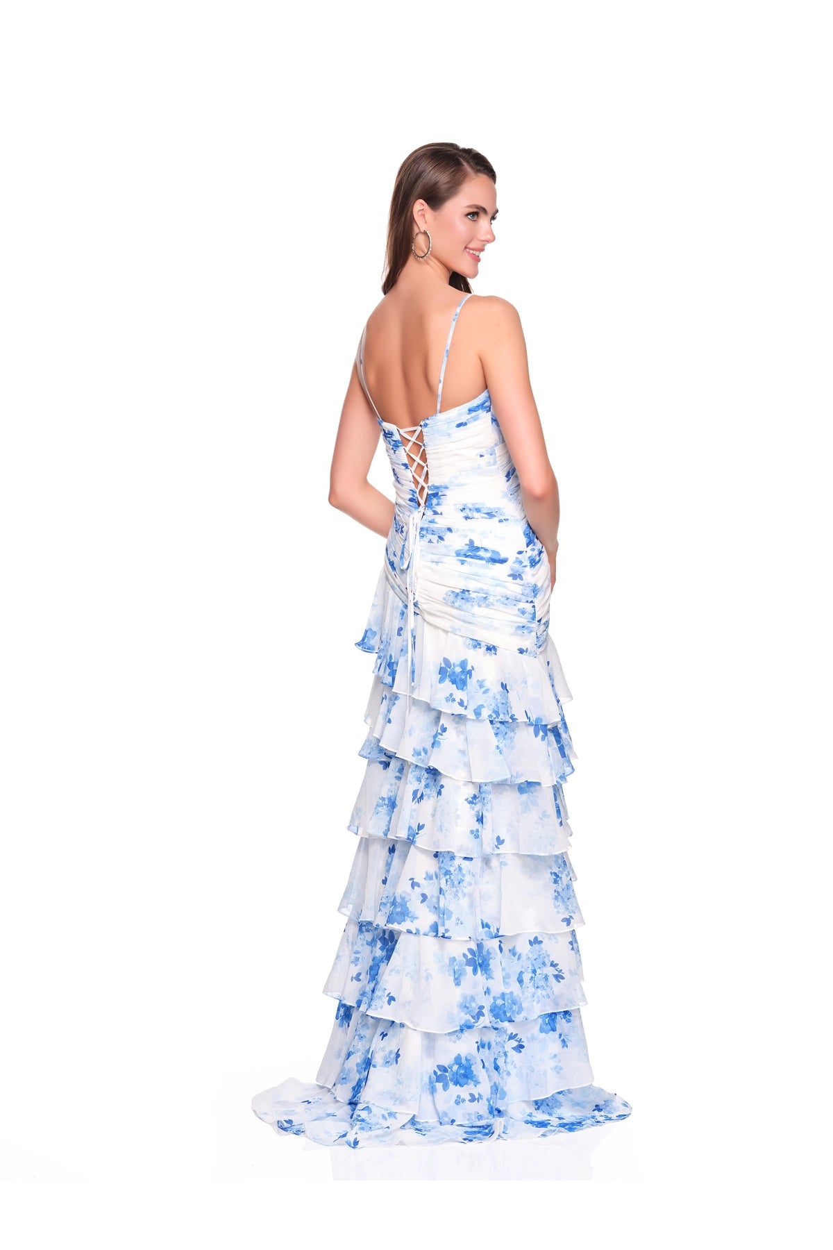 Woman wearing a blue and white floral tiered gown with lace-up back, Dave & Johnny Prom Dress Style 12939W