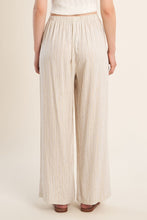 Back view of Light Beige Luxe Pants with subtle vertical stripes by Molly Bracken on a model against neutral background.