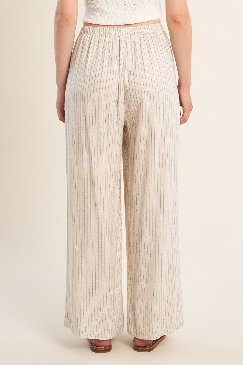 Back view of Light Beige Luxe Pants with subtle vertical stripes by Molly Bracken on a model against neutral background.