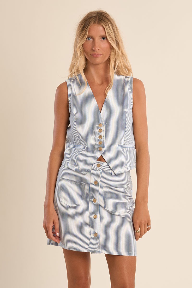 Woman wearing a sleeveless Blue Stripe Vest by Molly Bracken with button details and vertical stripes.