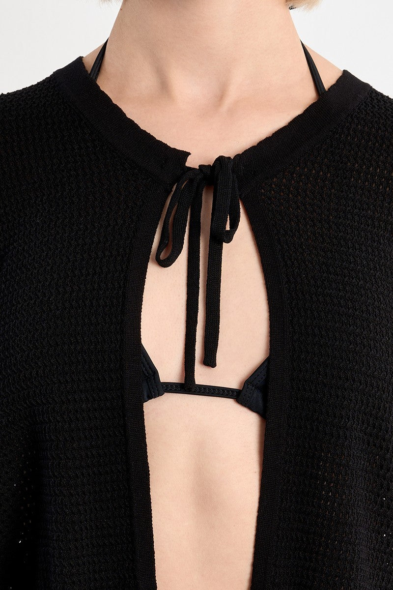 Close-up of a Black Belle Cardigan by Molly Bracken featuring textured knit and a tie closure at the neckline