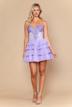 Woman wearing a strapless lilac tiered ruffle dress with lace detailing, E Young Homecoming Dress Style 26132 by Ed Young