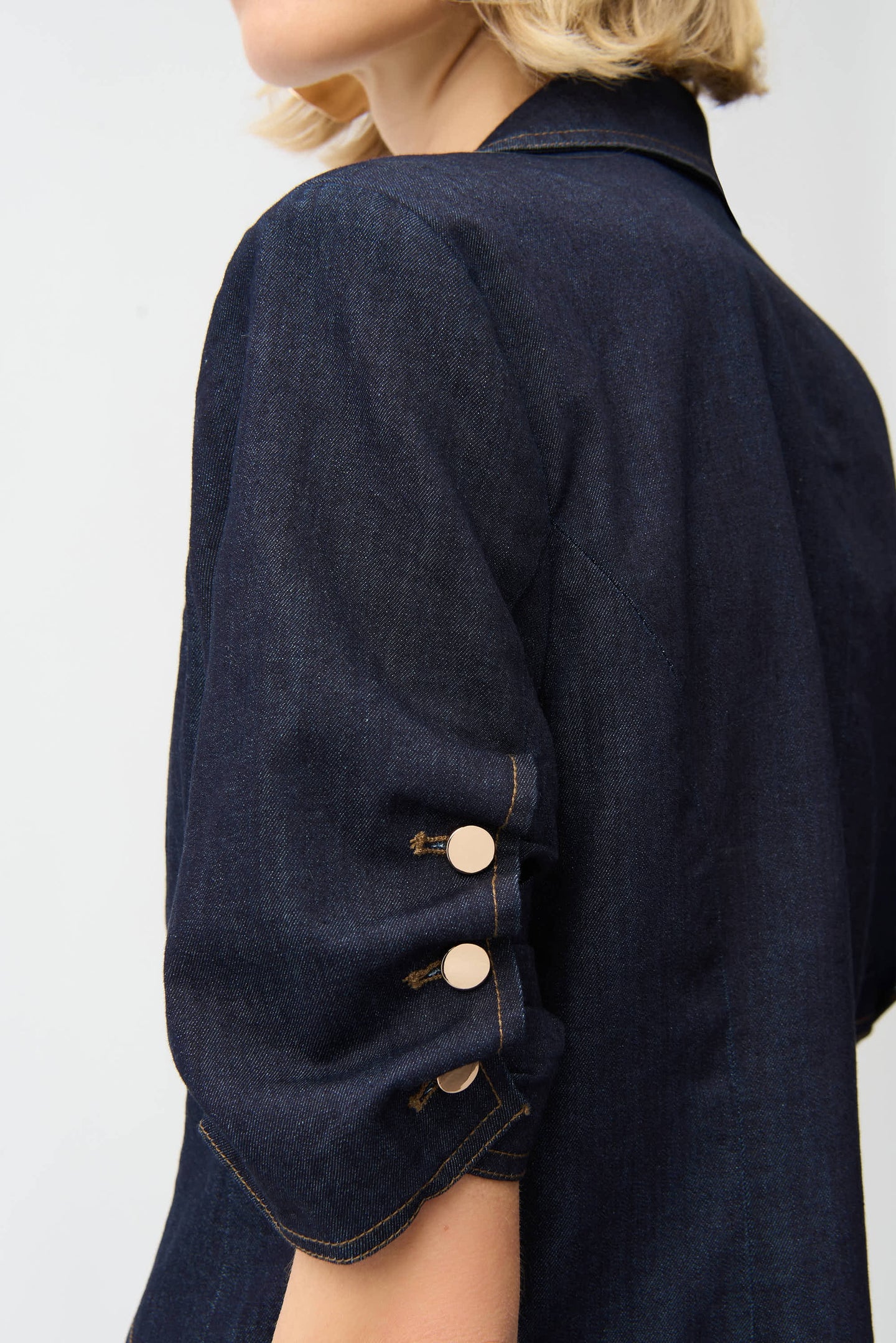Close-up of sleeve detail with gold buttons on Joseph Ribkoff Dark Blue Denim Fitted Blazer by JOSEPH Ribkoff