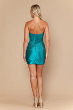 Back view of a woman wearing a strapless Jade Homecoming Dress by Ed Young adorned with sparkling details and nude heels.