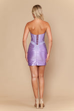 Back view of a woman wearing a lavender strapless E Young Homecoming Dress Style 26216 by Ed Young with lace-up detailing.