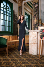 Navy Sparkle Wrap Gown by JOSEPH Ribkoff with long sleeves and a thigh high slit worn in an elegant interior