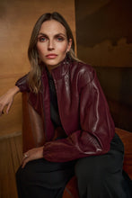JOSEPH Ribkoff Burgundy Bomber Jacket worn by a model in a burgundy leather finish