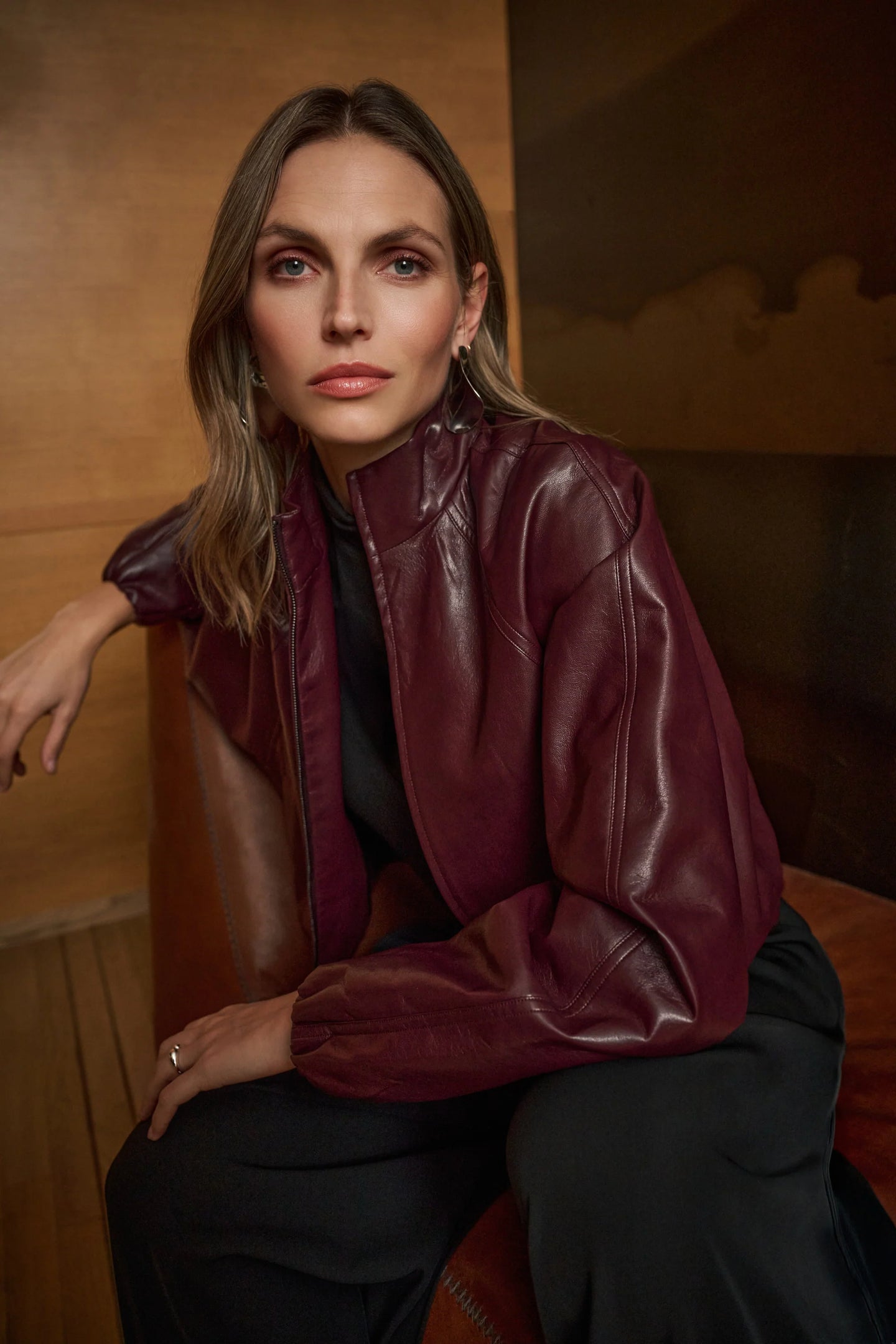 JOSEPH Ribkoff Burgundy Bomber Jacket worn by a model in a burgundy leather finish