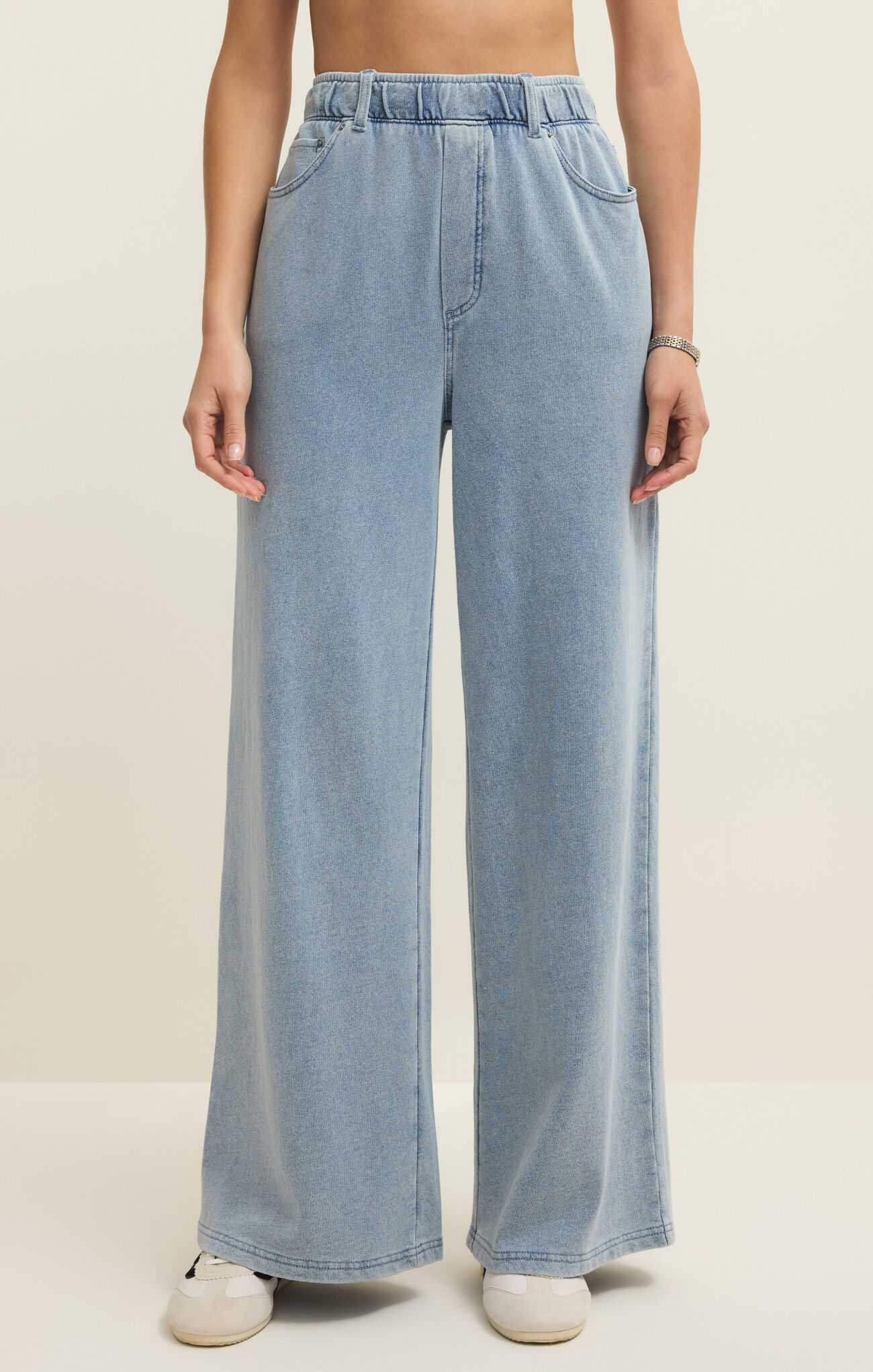 Model wearing light blue wide-leg Ocean Air Indigo Entrourage Knit Denim Pant by Z Supply