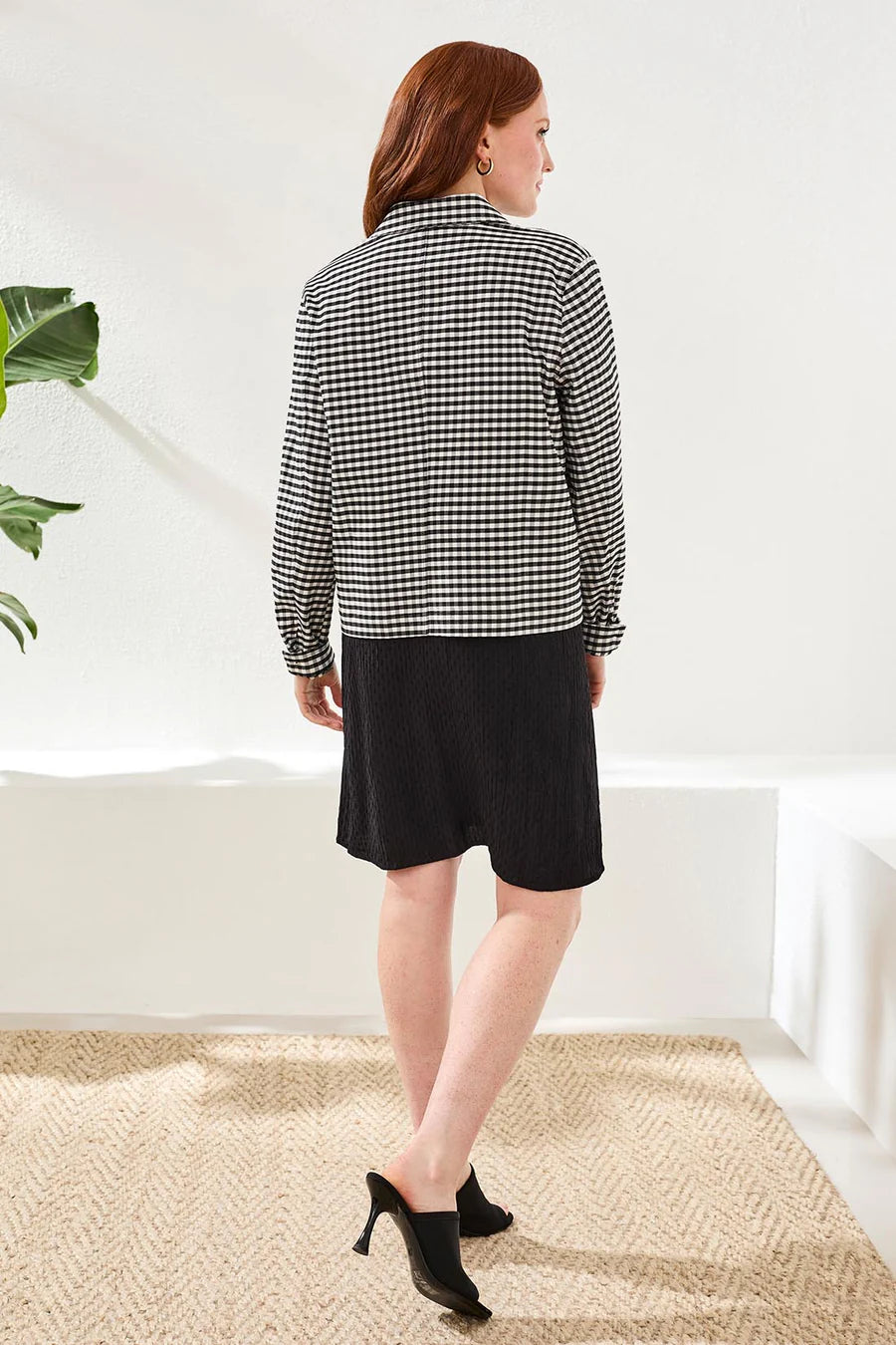 Back view of woman wearing Tribal Gingham Button Front Collared Jacket With Pockets in black and white gingham pattern
