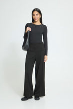 ICHI Twillish Wide Pant black wide leg trousers modeled by a woman