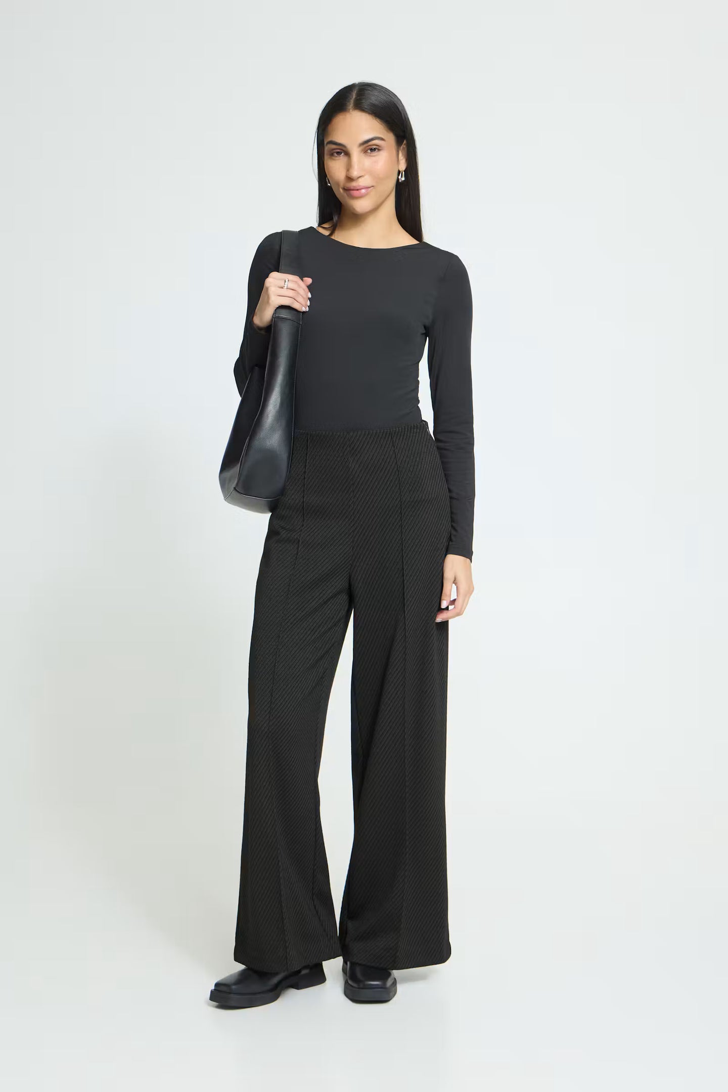ICHI Twillish Wide Pant black wide leg trousers modeled by a woman
