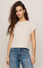 Woman wearing a Cloud Marika Lace Trim Muscle Tee by z supply in cream with lace sleeve detail and blue jeans