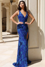 Jovani Prom Dress Style 40757 royal blue sleeveless gown with deep V neckline and thigh-high slit on model outdoors