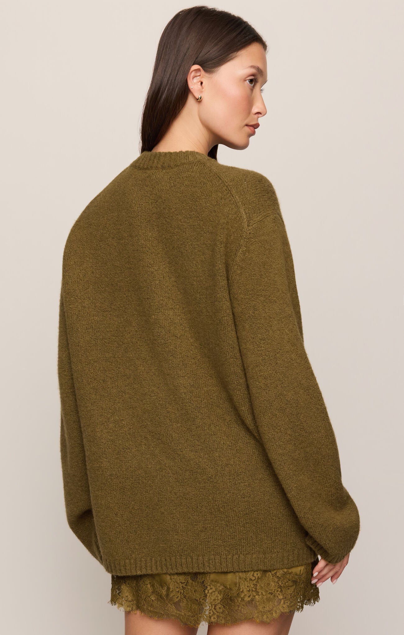 Golden Sage Chill Mode Sweater by z supply shown from the back with a lace hem detail