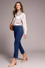 Woman wearing Tribal Audrey Pull-On Crop Straight Jeans with Front Crease styled with blouse and ankle boots in a neutral setting
