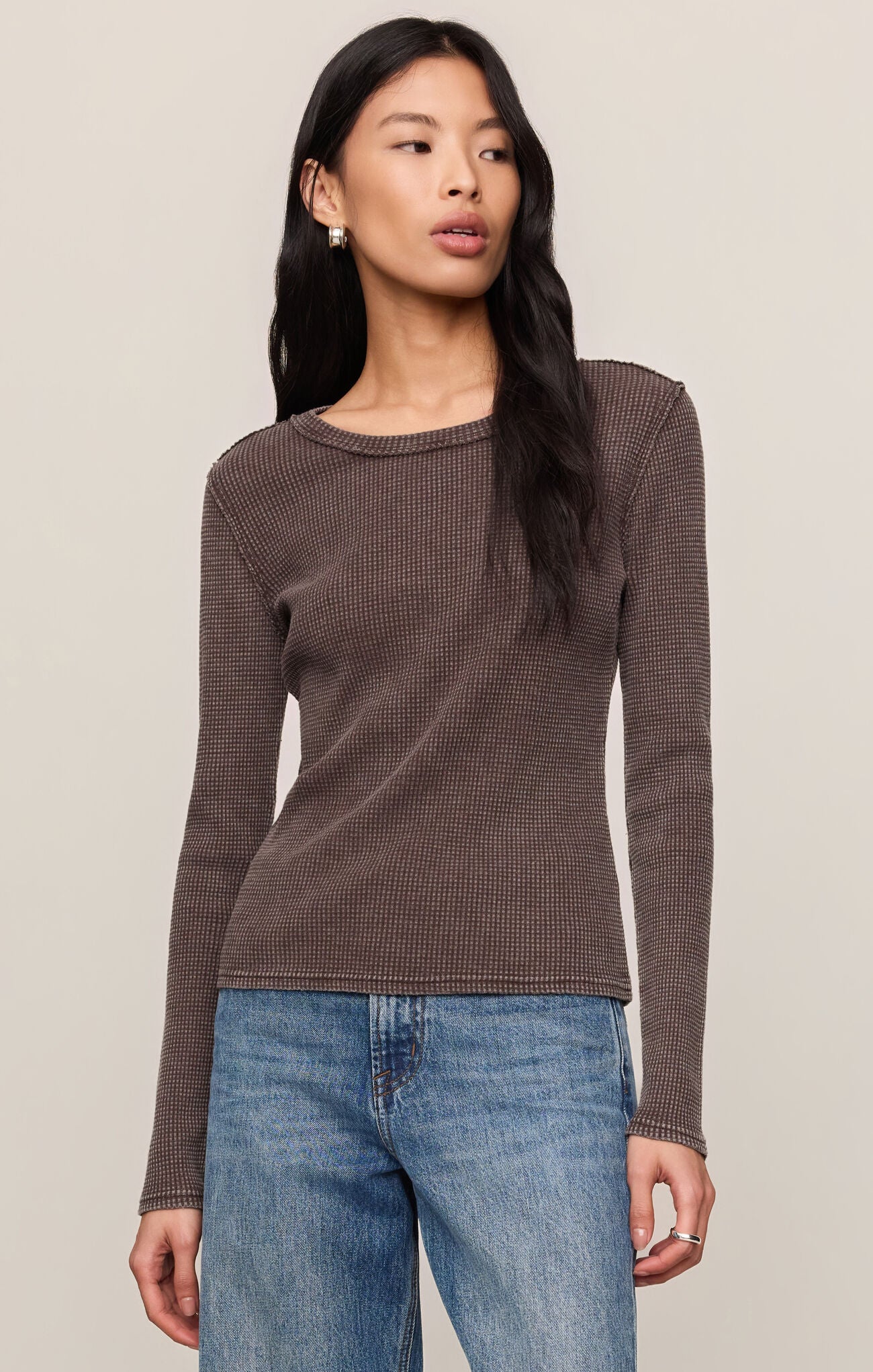 Woman wearing a dark brown textured Dark Chocolate Arlet Mini Thermal Top by z supply with long sleeves and crew neck
