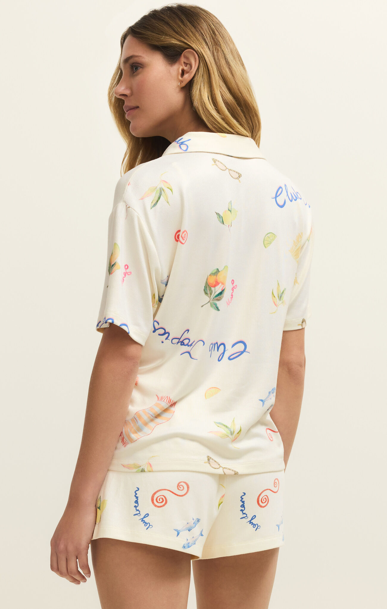 Back view of a woman wearing z supply Vanilla Ice Beach Days PJ Top with colorful coastal prints on lightweight fabric