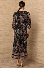 Black Adriel Print Maxi Dress by hale bob shown from the back with floral print long sleeves and tiered hem
