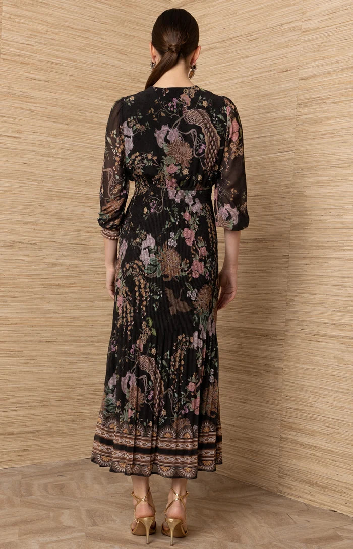Black Adriel Print Maxi Dress by hale bob shown from the back with floral print long sleeves and tiered hem