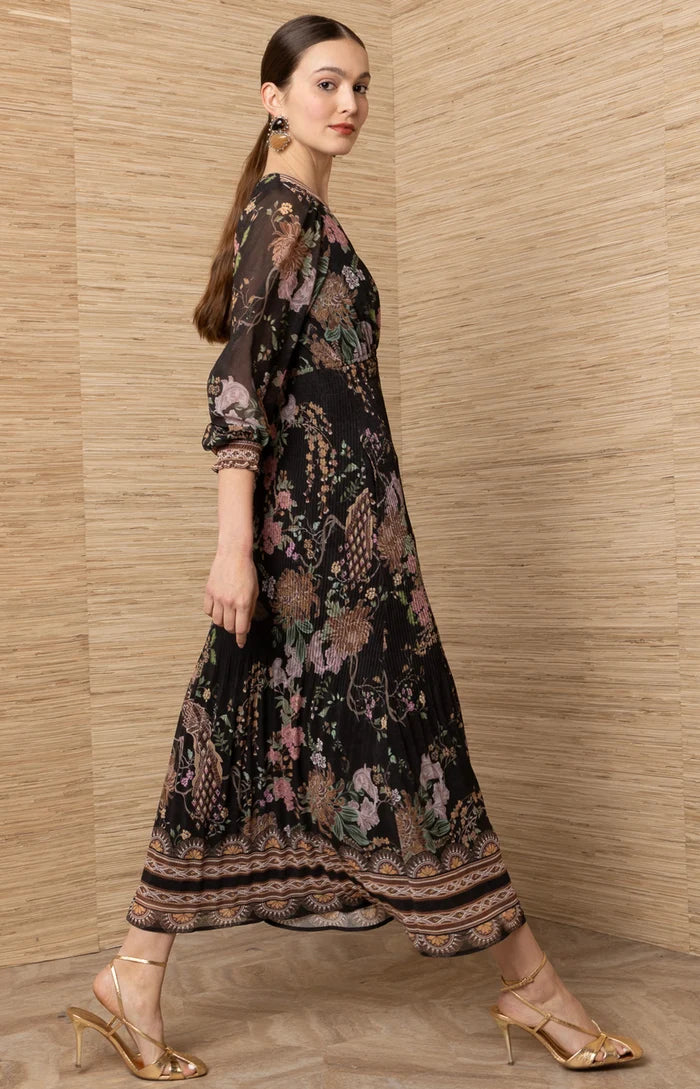 Black Adriel Print Maxi Dress by hale bob modeled in a flowing black floral dress with long sleeves