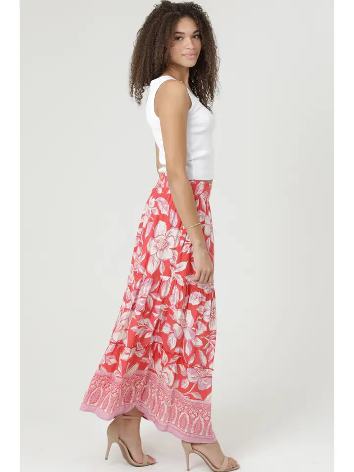 Woman wearing angie Printed A-line Maxi Skirt with red and white floral pattern paired with white sleeveless top