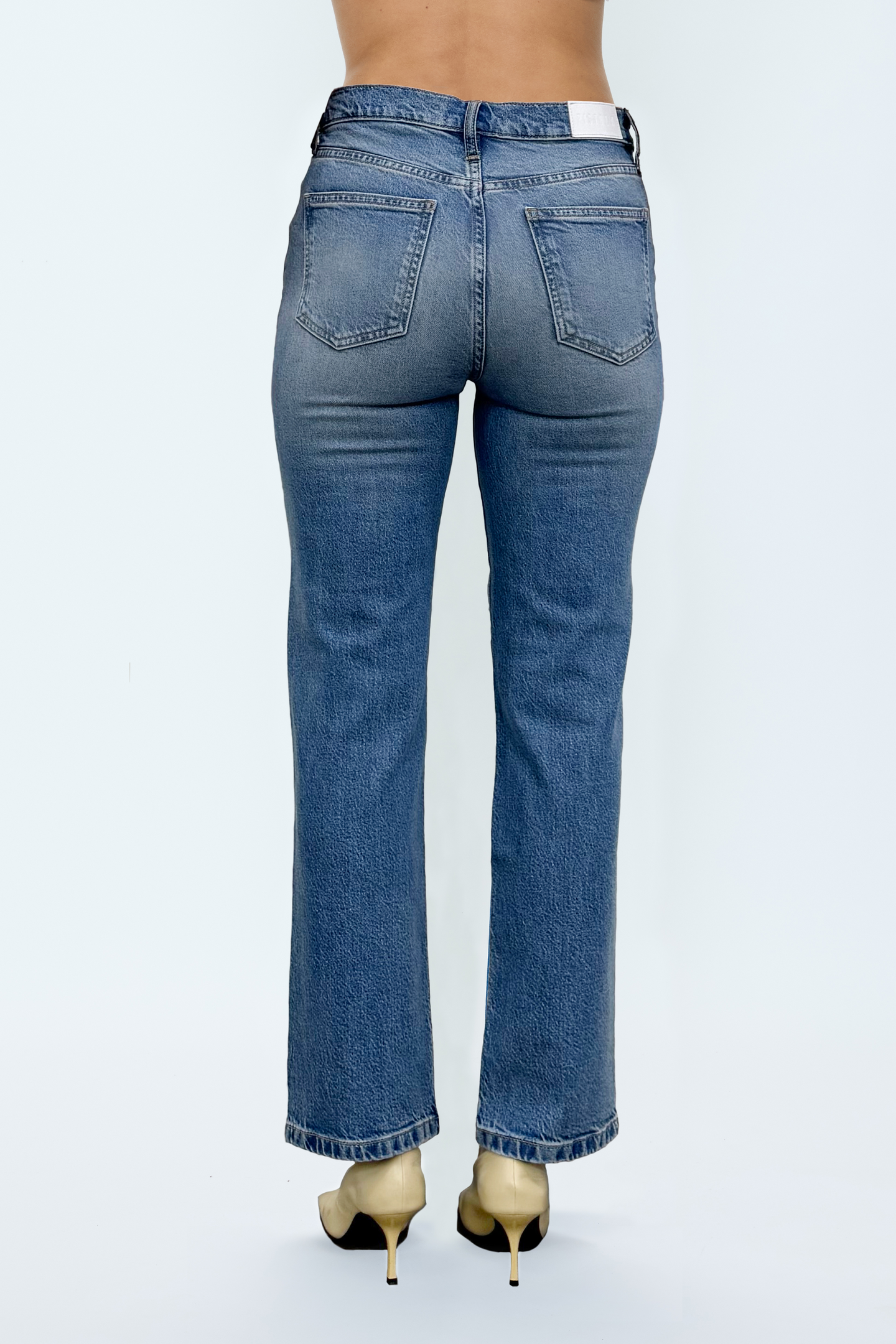 Back view of Muse Aleks jeans by pistola in classic blue denim with a flattering tailored fit and straight leg design.