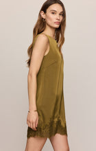 Z Supply olive sleeveless mini dress, side view showing the lace-trim hem