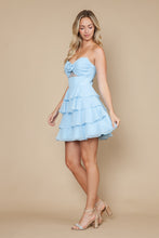 Woman wearing a strapless light blue tiered ruffle dress posing with heels, Ed Young E Young Homecoming Dress Style 9802