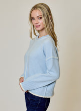 Blue Echo Sweater by design history in light blue with contrast trim modeled by a woman