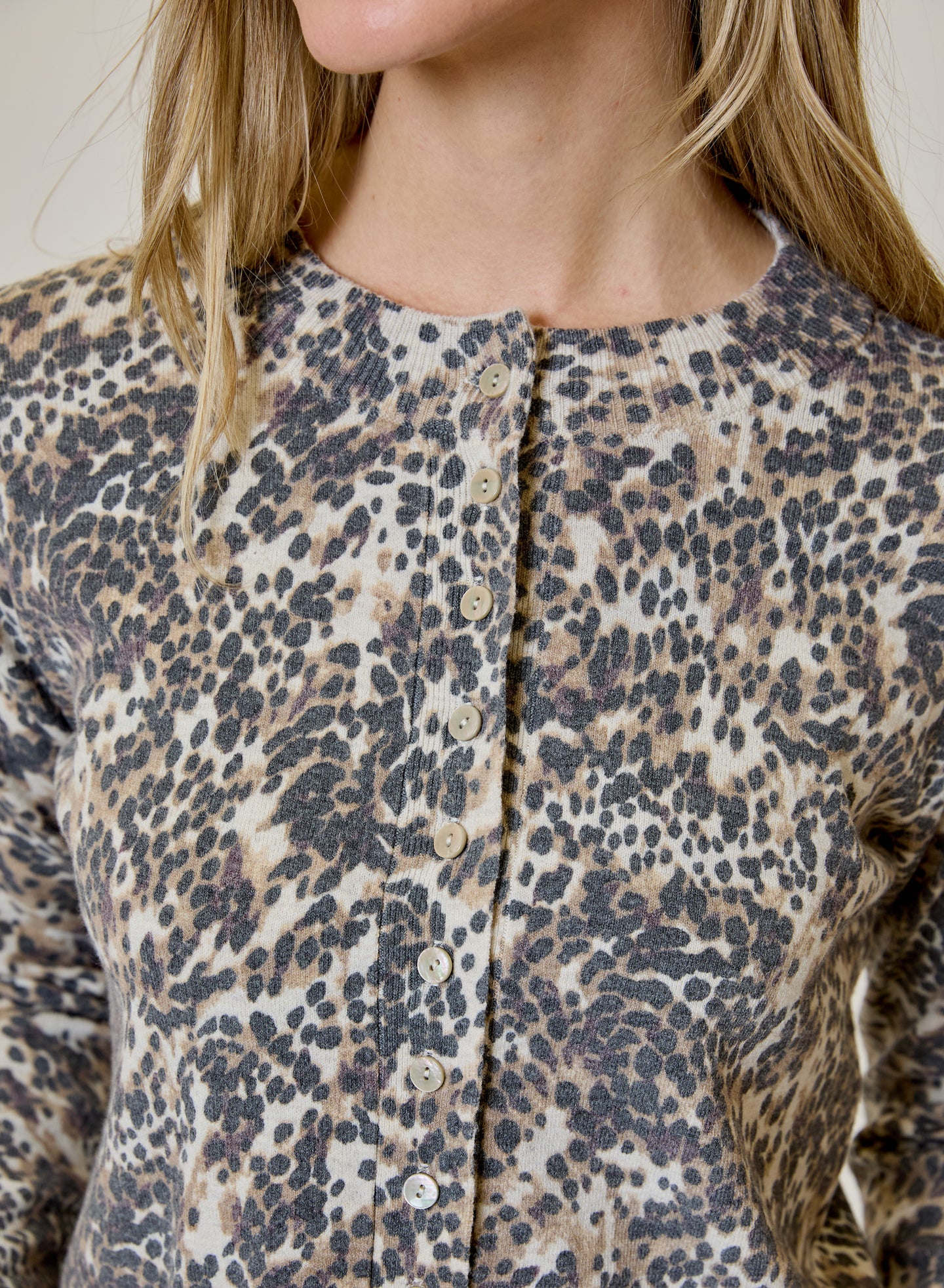 Animal Print Cardigan by design history featuring a leopard print and button front