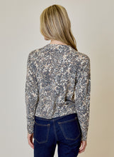 Animal Print Cardigan by design history shown from the back in leopard print with dark jeans