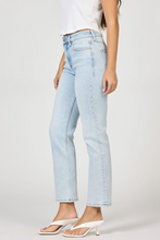 Model wearing light wash Positano Anika Jeans by dear john with straight leg and clean hem styling in casual look