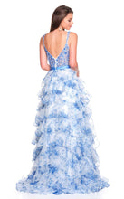 Back view of Dave & Johnny Prom Dress Style 12765W featuring tiered blue floral ruffled skirt and low V back design