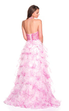 Back view of a model wearing Dave & Johnny Prom Dress Style 12766 in pink with layered ruffle skirt and halter neck design