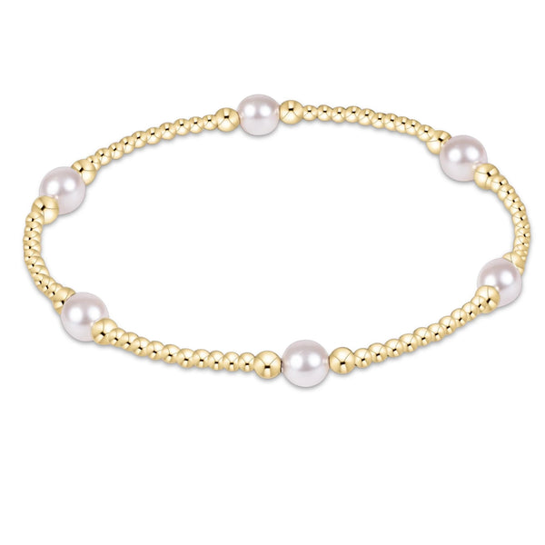 Enewton Purpose Pearl 5mm Gold bracelet with white pearls spaced between gold bead sections
