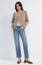 Woman wearing Gold Rush Moto Jacket by liverpool in a textured neutral knit paired with casual jeans and heels