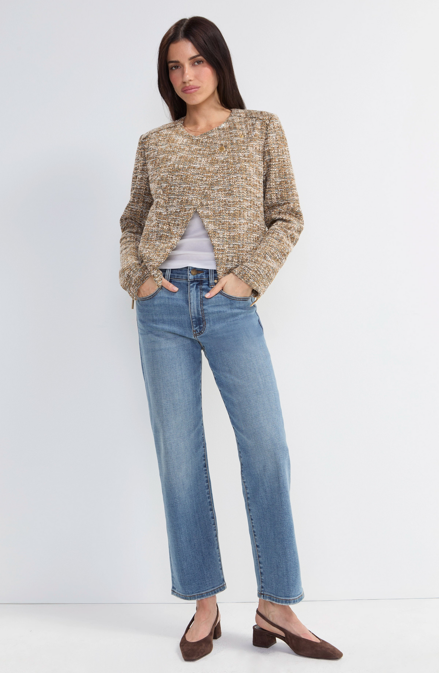Woman wearing Gold Rush Moto Jacket by liverpool in a textured neutral knit paired with casual jeans and heels