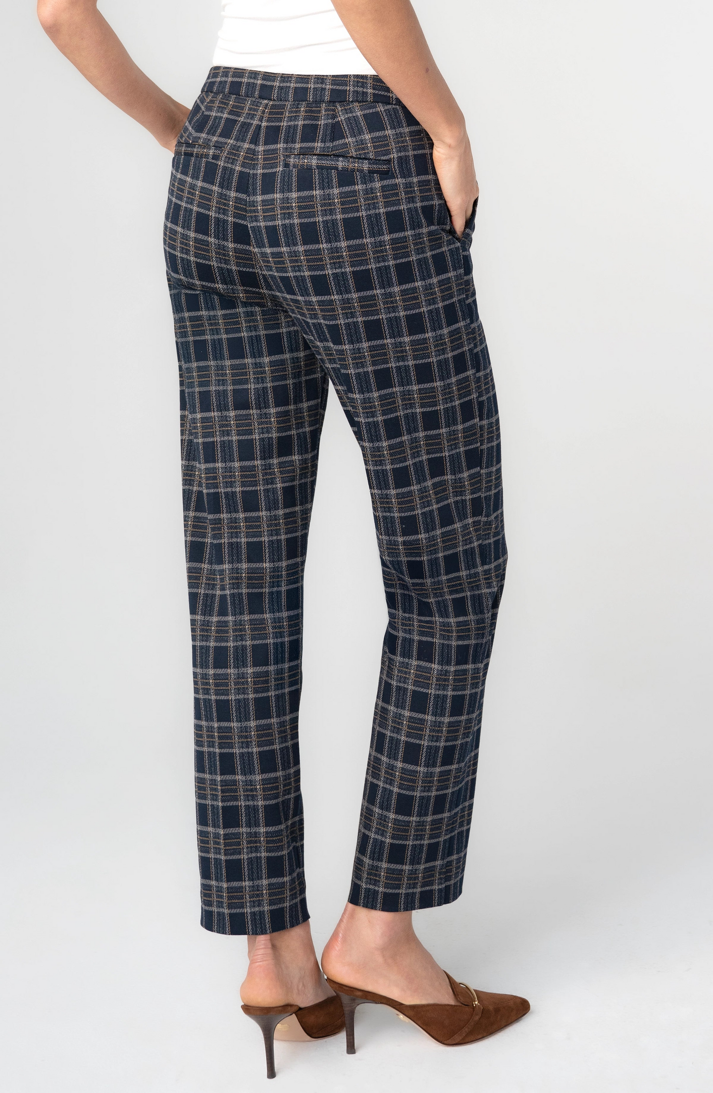 Plaid Kayla Pull On Trouser 28" Ins by liverpool shown from back with navy plaid pattern and brown heels.