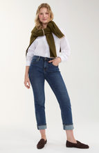 Woman wearing Rushland Marley Girlfriend Cuffed 27 Rolled/30 Ins jeans styled with white shirt and green scarf by liverpool