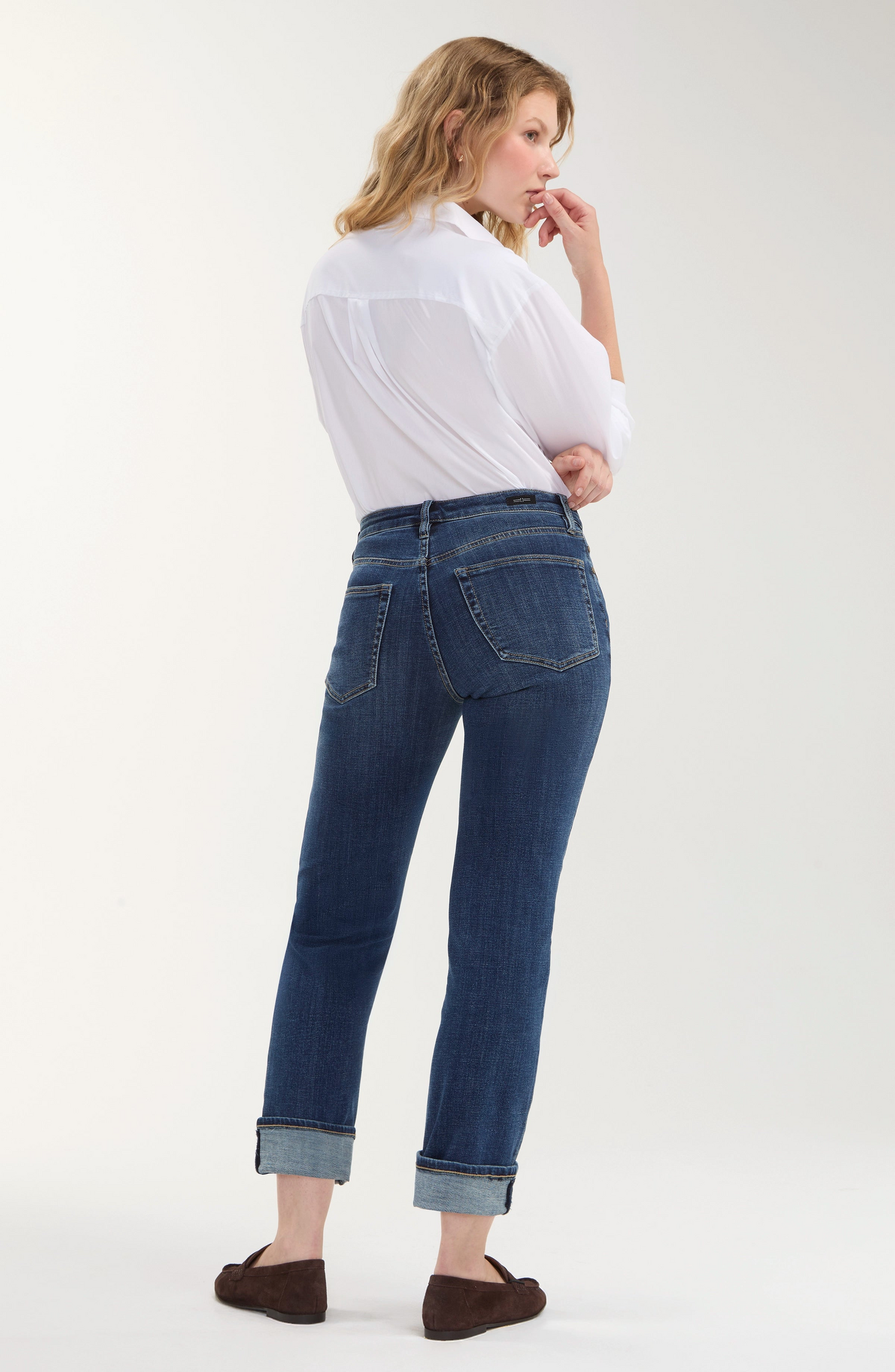 Woman wearing Rushland Marley Girlfriend Cuffed 27 Rolled/30 Ins jeans by liverpool, styled with a white shirt and loafers.