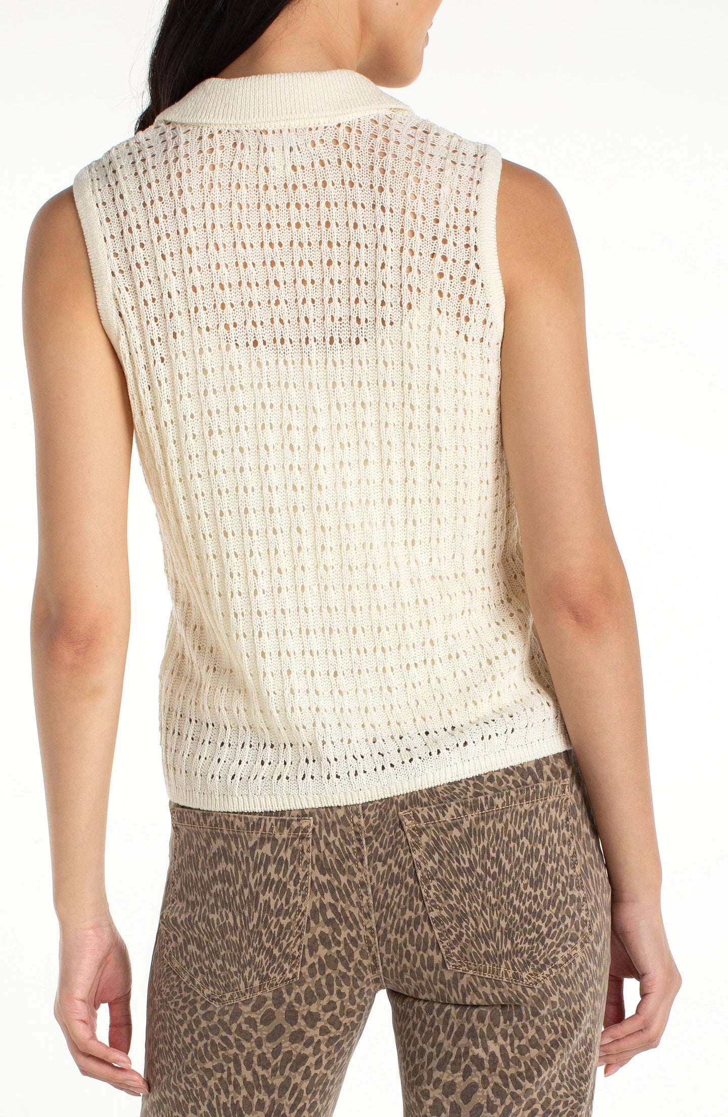 Model wearing a Cream Sleeveless Johnny Collar Sweater by liverpool with a delicate open knit design.